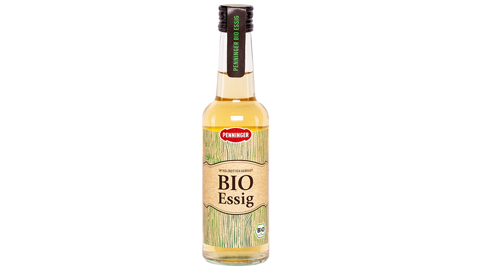Penninger Flasche mit hellem Bio Essig und schwarzem Deckel.. 