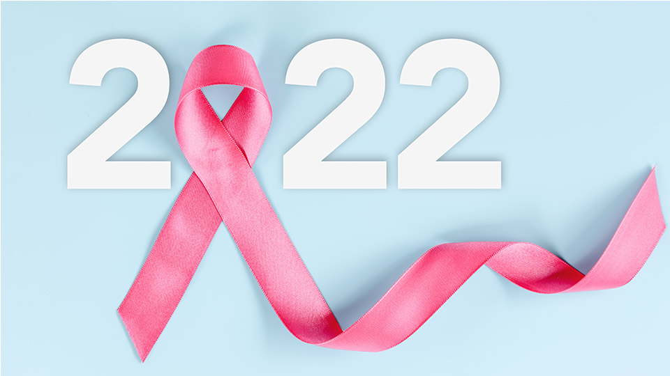 Die rosa Schleife oder "Pink Ribbon", die weltweit als Symbol gegen Brustkrebs gilt, bildet die Null in einer in weiß dargestellten Jahreszahl 2022. Der Hintergrund ist hellblau.