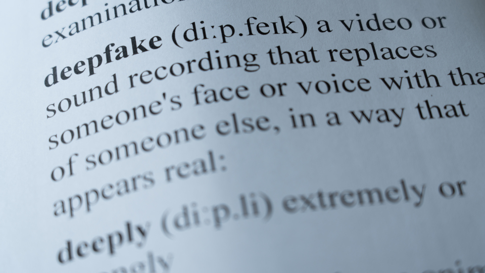 A mock up of a dictionary page with the word deepfake with selective focussing