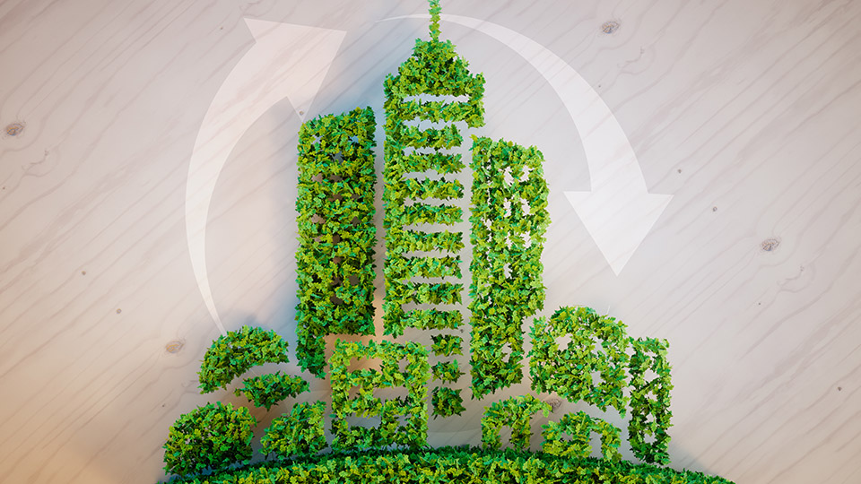 Recycling: Darstellung einer Stadt aus Gras und das Symbol für Kreislaufwirtschaft 